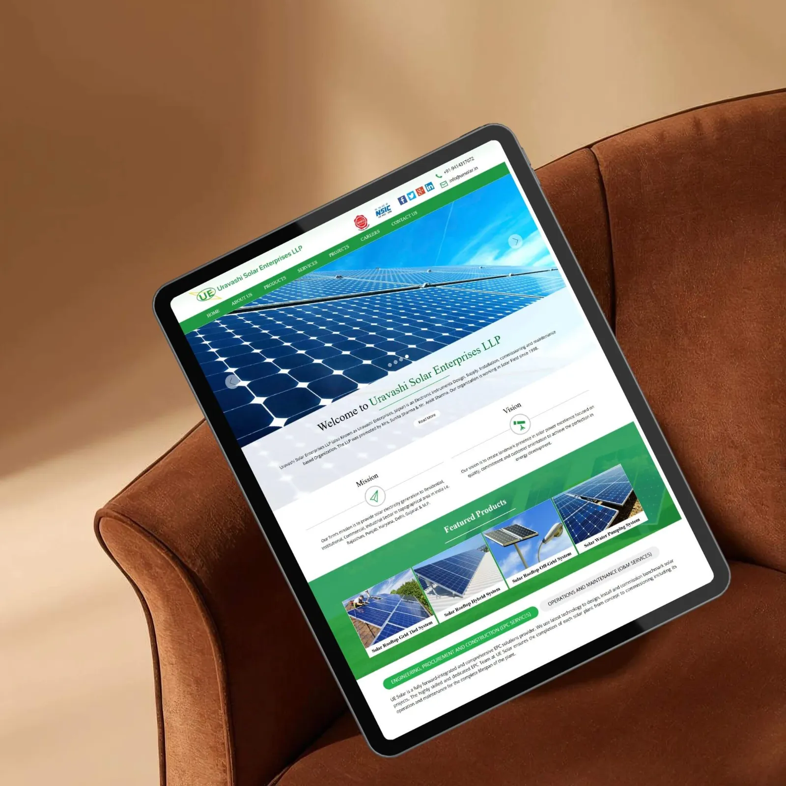 Uravashi Solar Enterprises LLP website designed by CoregenX, shown on a tablet